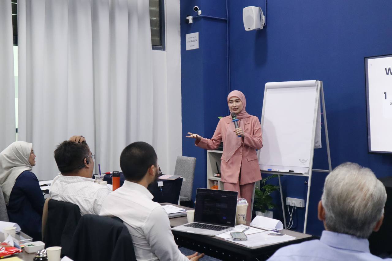 Iman Abdul Rahim — Licensed Financial Planner, presenting at a workshop